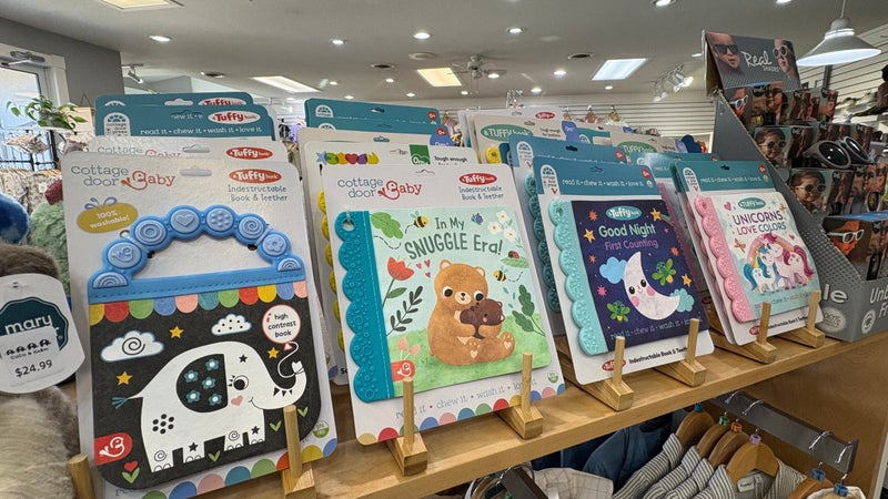 Tufy books on a wooden display