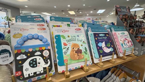 Tufy books on a wooden display