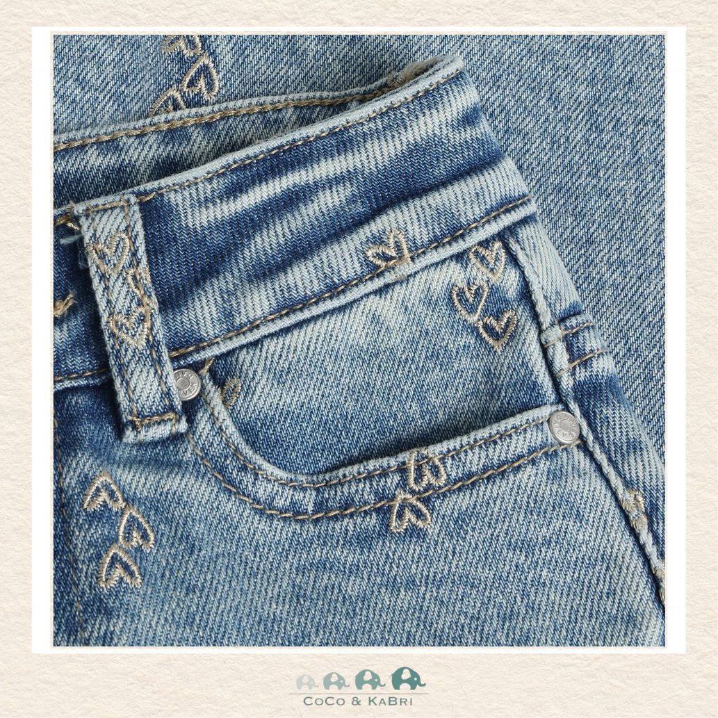 Close-up detail of the Daily7 Denim highlighting the intricate heart embroidery and the high-quality stitched finish