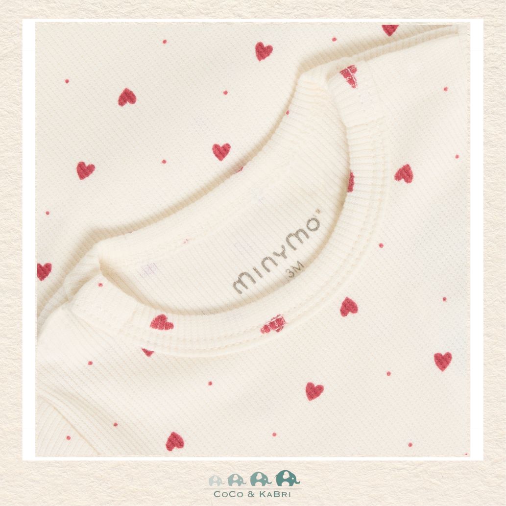 Close-up detail of the Minymo Heart Blouse highlighting the intricate print and the high-quality, natural fibers of the soft woven cotton