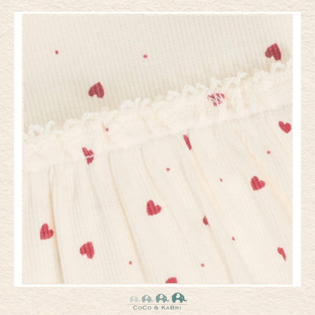 Close-up detail of the Minymo Heart Dress highlighting the premium knit texture and the high-quality finish of the breathable stretch fabric