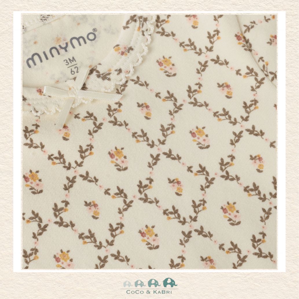 Close-up detail of the Minymo Floral Diaper Shirt highlighting the intricate wildflower pattern and the breathable, high-quality Seedpearl fabric texture