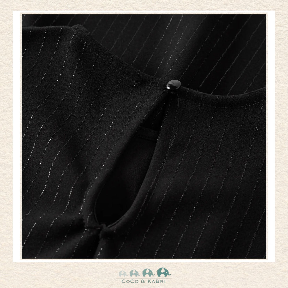Detailed close-up of the Name It fabric highlighting the high-quality weave and the deep, saturated black finish of the premium boutique material