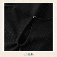 Detailed close-up of the Name It fabric highlighting the high-quality weave and the deep, saturated black finish of the premium boutique material