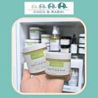Peas_in_a_Pod_Bum_Balm in front of display
