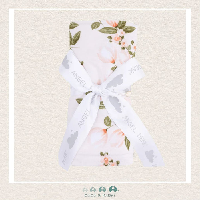 Angel Dear Floating Magnolia swaddle blanket rolled and tied with a boutique ribbon for an elegant, botanical-themed gift presentation | Canada