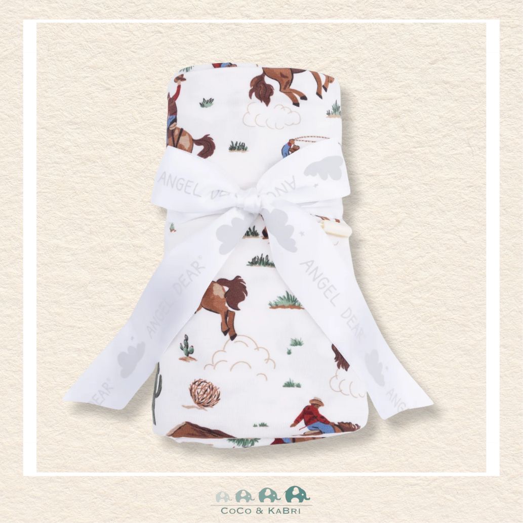 Angel Dear Buckaroo Western swaddle blanket rolled and tied with a boutique ribbon for a spirited cowboy-themed gift presentation | Canada
