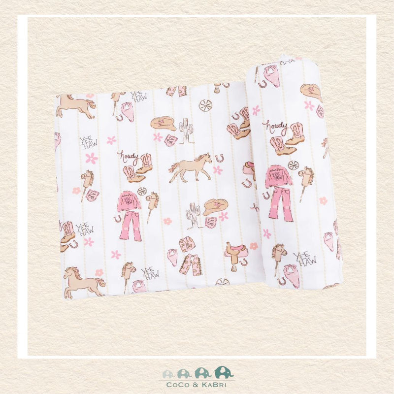 Angel Dear Cowgirl Nursery swaddle blanket rolled out showing the generous size and whimsical hand-drawn ranch life illustrations on soft bamboo | Canada