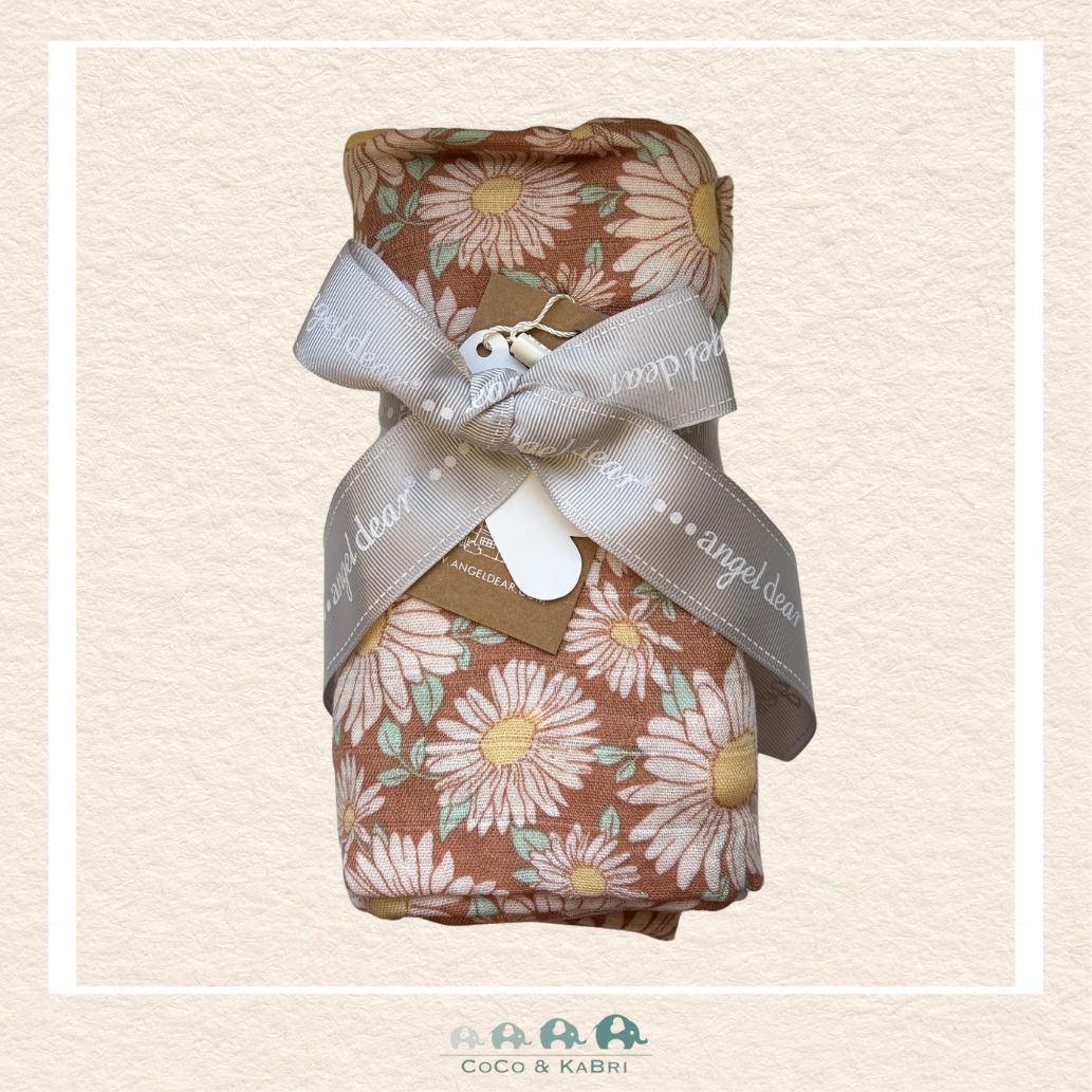 Angel Dear Daisy Days swaddle blanket rolled and tied with a boutique ribbon for a cheerful floral gift presentation | Canada
