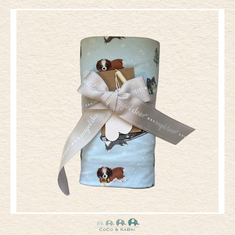 Angel Dear Dogs on Sled swaddle blanket rolled and tied with a boutique ribbon for a playful winter-themed gift presentation | Canada