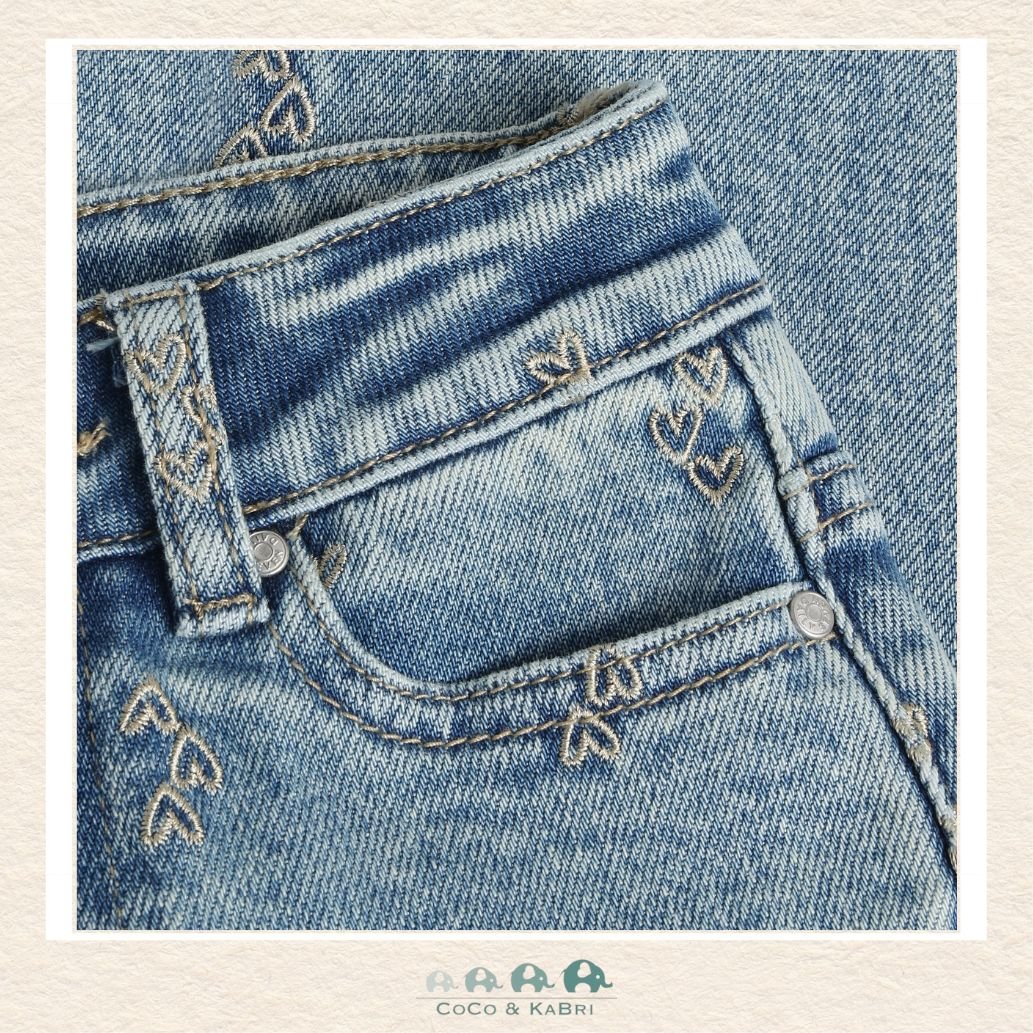 Close-up detail of the Daily7 Denim highlighting the intricate heart embroidery and the high-quality stitched finish