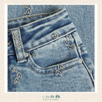 Close-up detail of the Daily7 Denim highlighting the intricate heart embroidery and the high-quality stitched finish