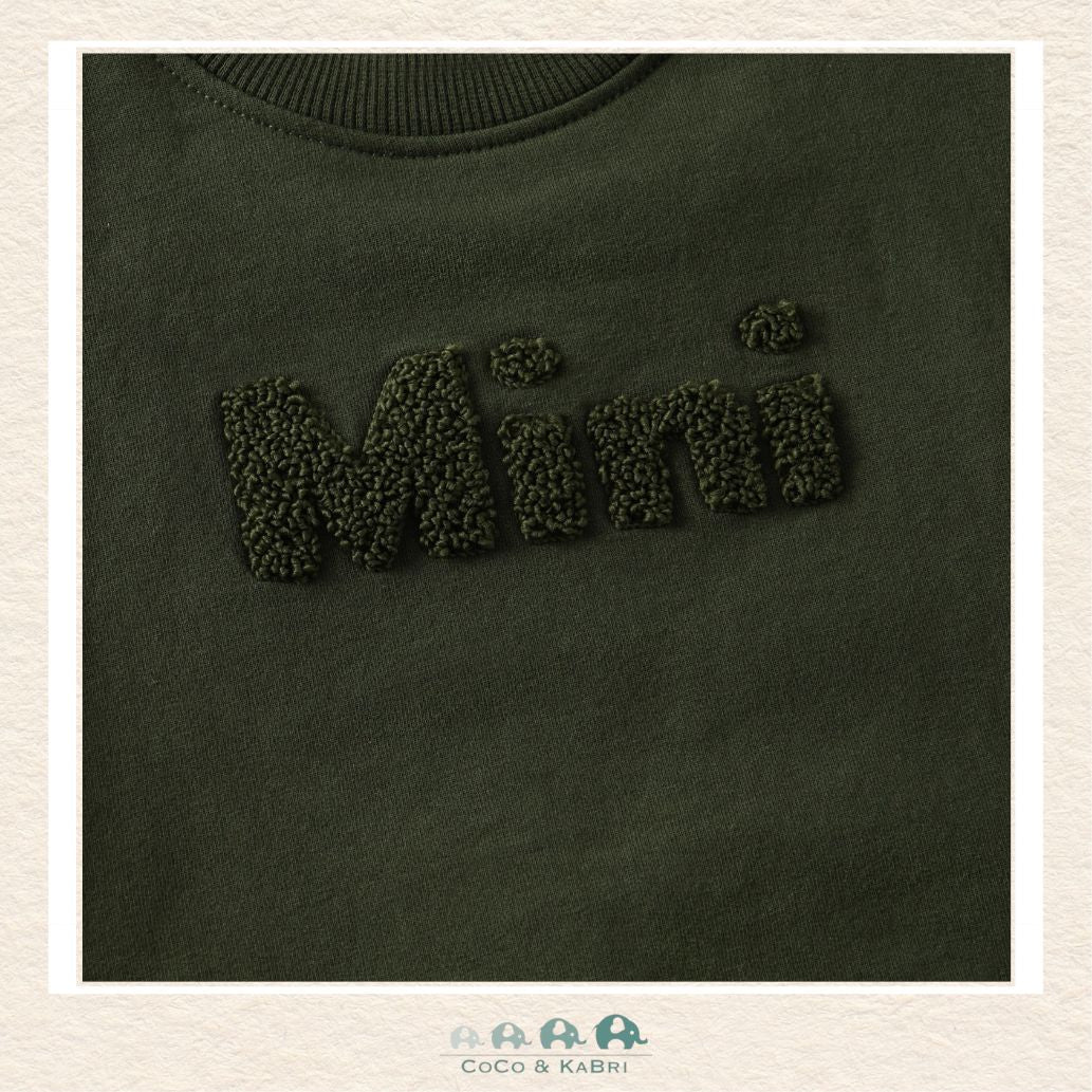 Close-up detail of the En Fant Sweatshirt highlighting the delicate "Mini" embroidery and the plush, premium texture of the sage green fabric