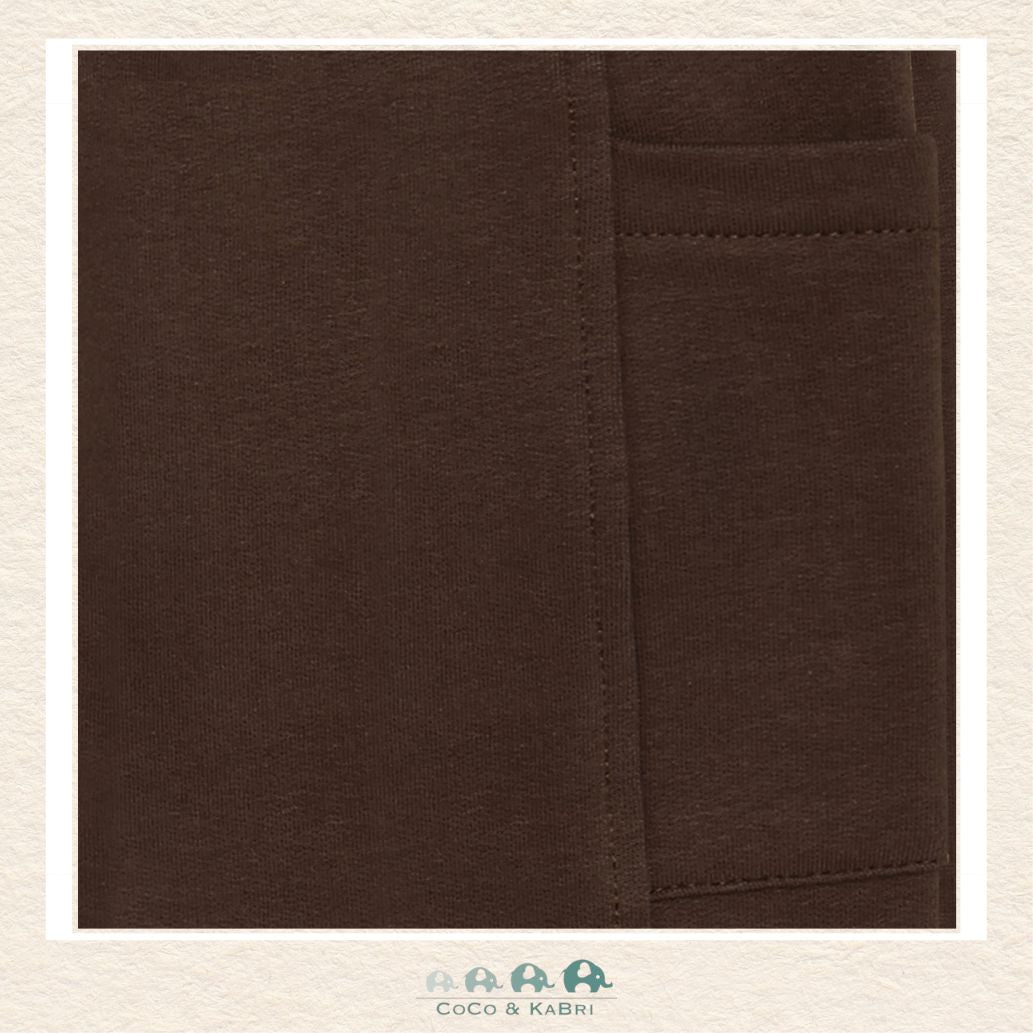 Close-up detail of the En Fant Sweatpants highlighting the deep brownish-red fabric texture and the durable, soft-touch stitching