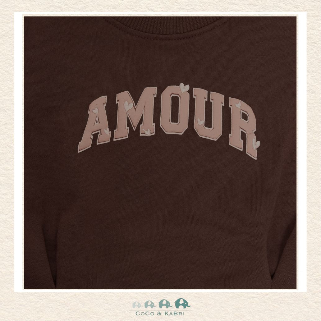 Close-up detail of the En Fant Sweatshirt highlighting the intricate "Amour" embroidery and the plush, premium texture of the Mahogany fabric