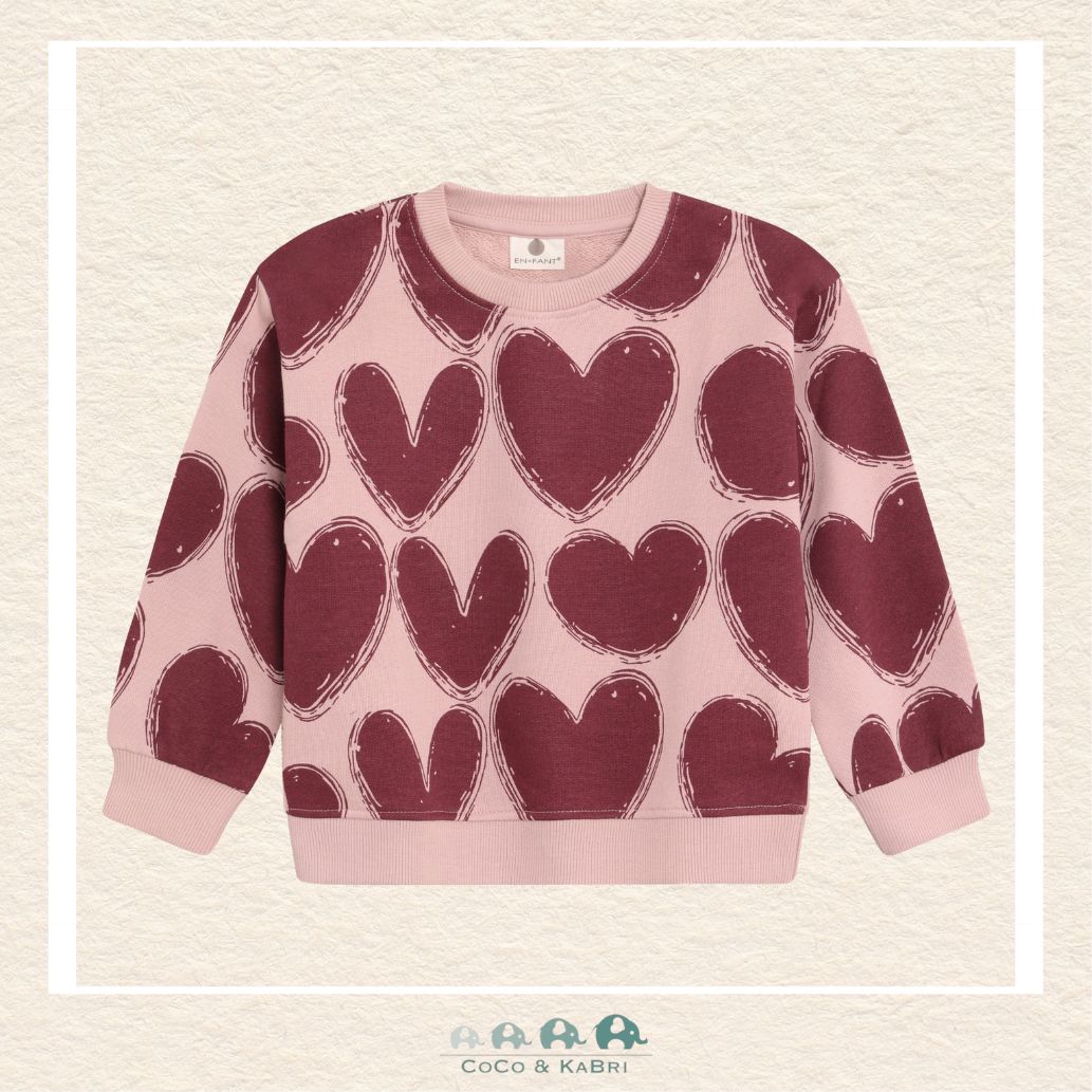 Front view of the En Fant Girl's Sweatshirt featuring a playful all-over pink and red heart pattern on a soft, high-quality knit fabric