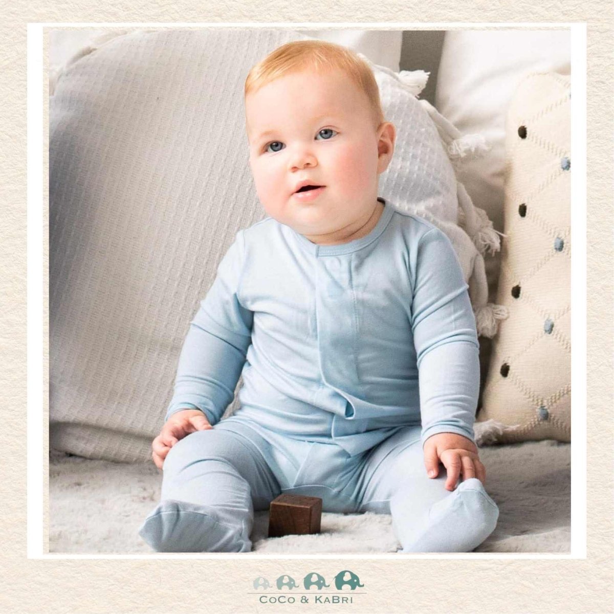 Magnetic Me Baby Blue Modal Footie on infant showing the classic soothing color and easy-access magnetic closure design | Canada