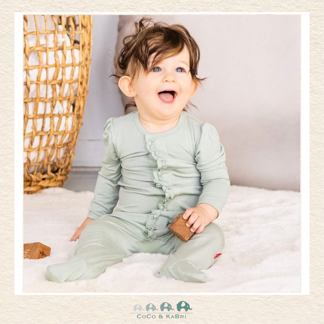 Lifestyle view of a baby wearing the Magnetic Me Seafoam modal ruffle footie showing the charming ruffle accents and flexible boutique design in action | Canada