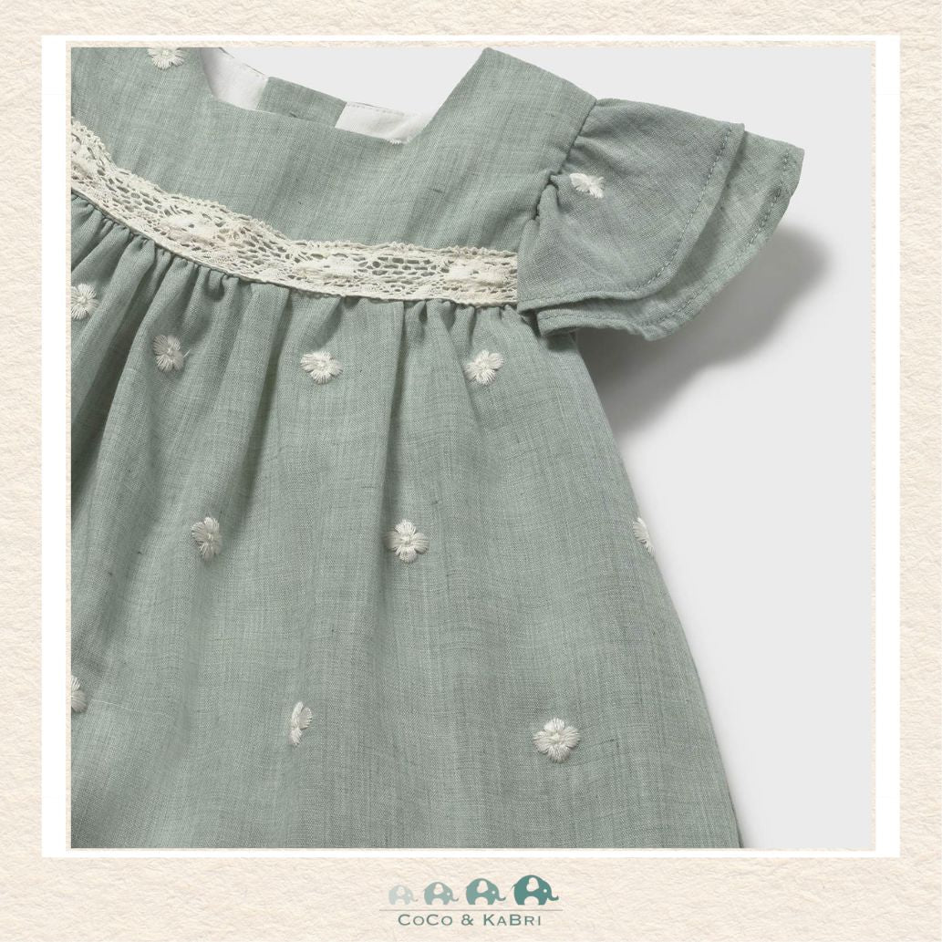 Close-up of Mayoral dress fabric showing the intricate embroidery accents and premium textured finish | Canada