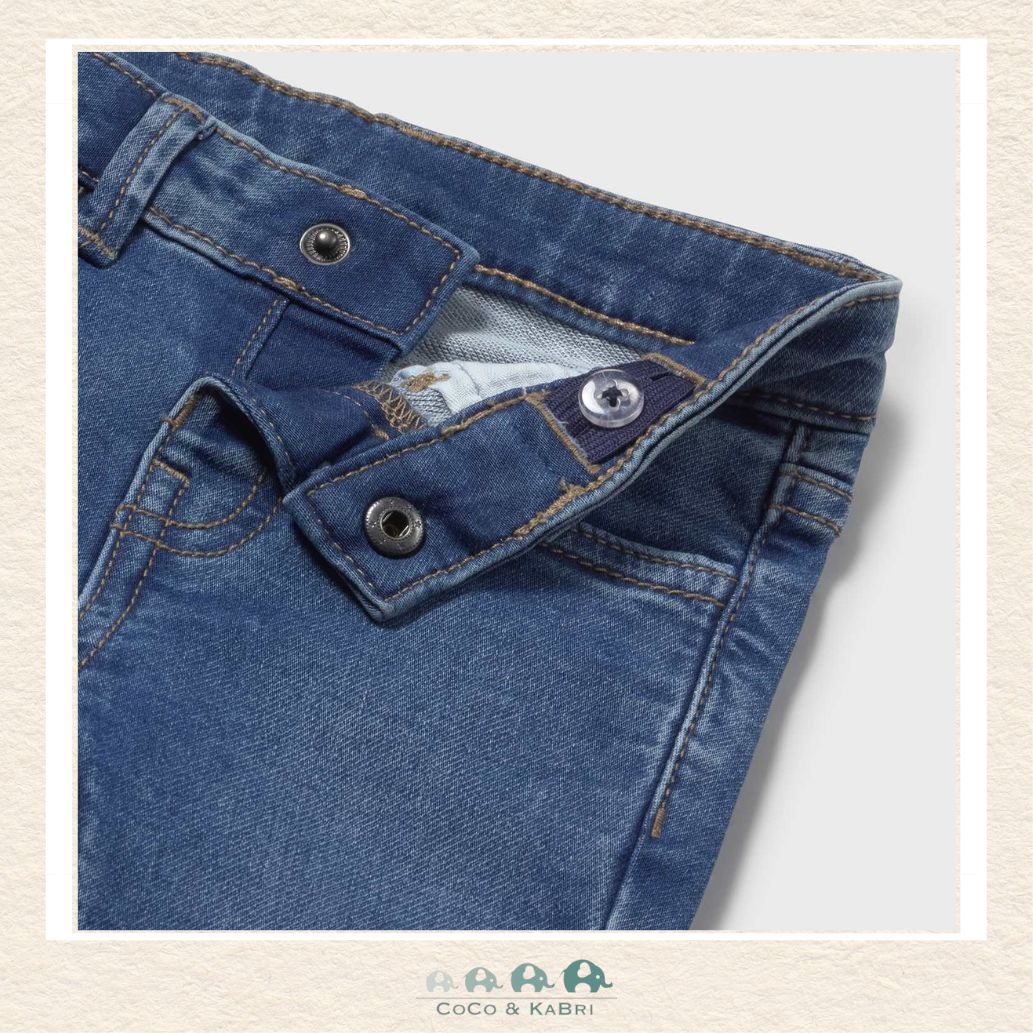 Close-up of Mayoral denim fabric showing the premium textured indigo wash and soft-stretch finish | Canada