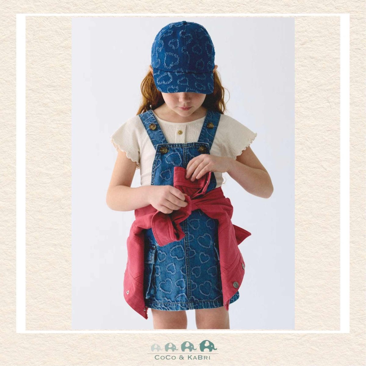 Mayoral Girls Denim Overall Dress on model showing the whimsical heart pattern and soft Lyocell-blend fit | Canada
