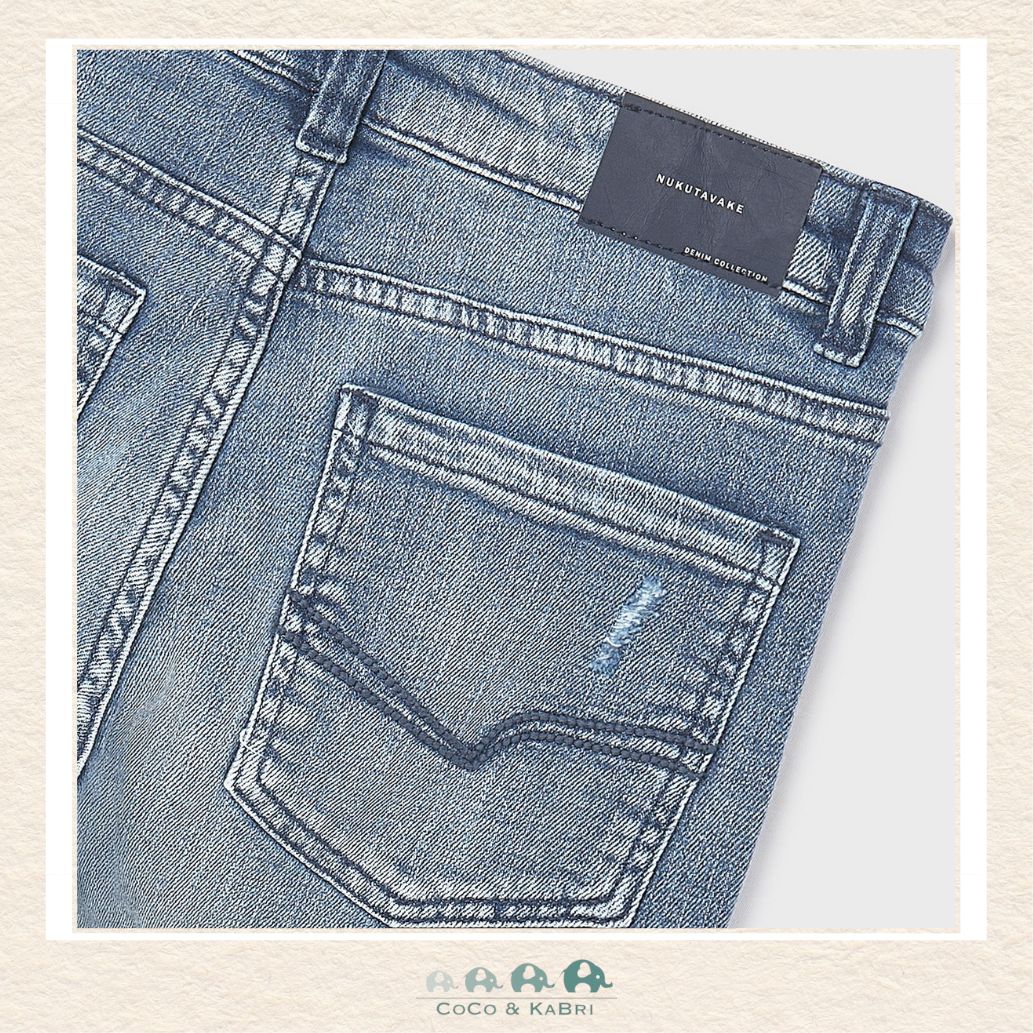 Close-up of Mayoral denim fabric showing the rugged cotton blend and light-blue wash | Canada