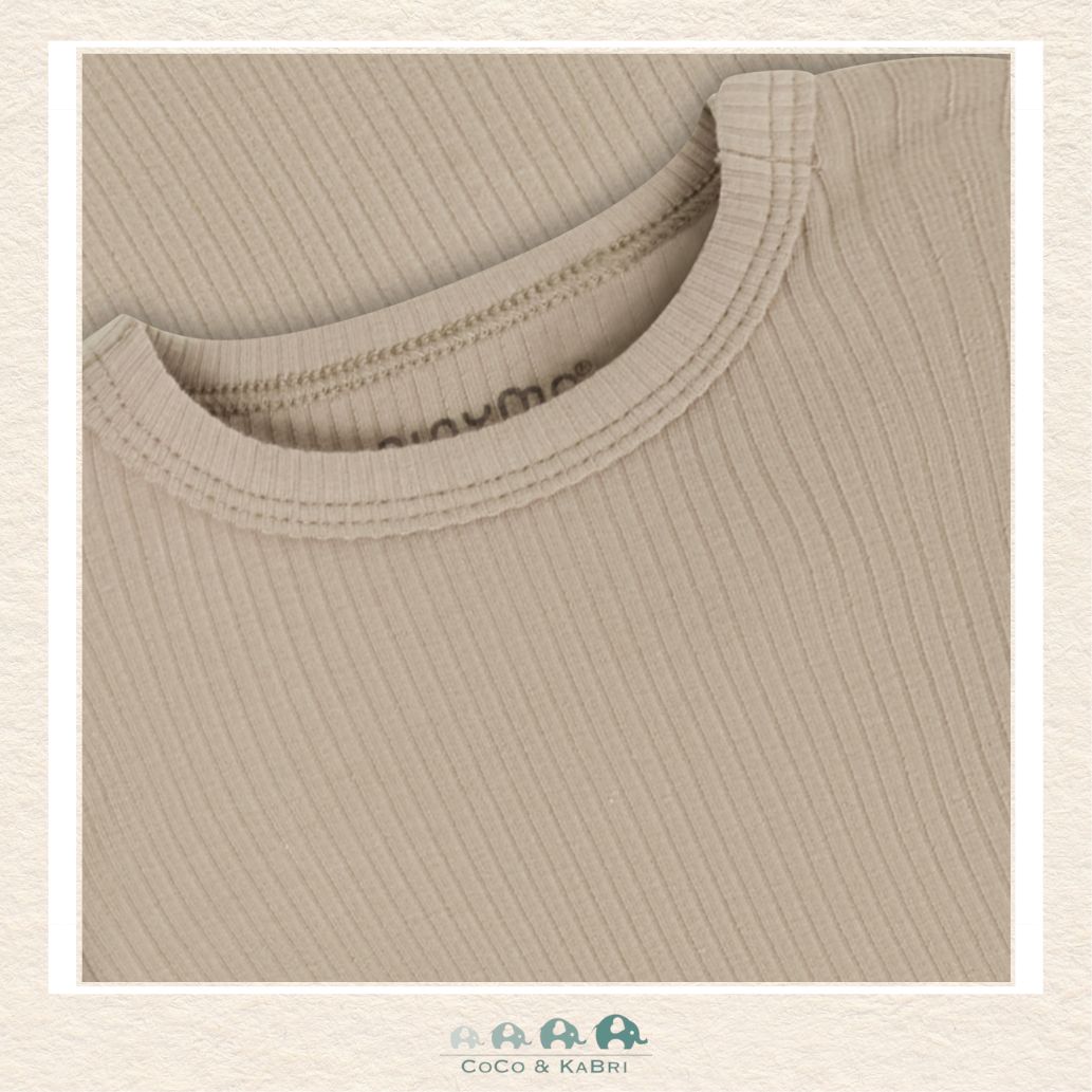 Close-up of the taupe bodysuit highlighting the premium vertical ribbing and the soft-touch stretch fabric designed for maximum comfort