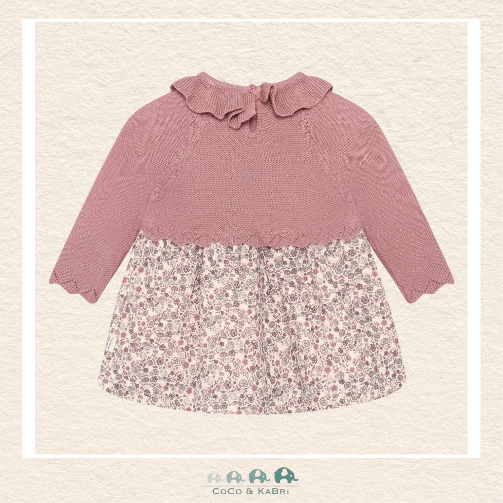 Back view of the baby girl cotton dress showcasing the clean, minimalist design and the comfortable, non-restrictive fit through the shoulders