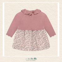 Back view of the baby girl cotton dress showcasing the clean, minimalist design and the comfortable, non-restrictive fit through the shoulders