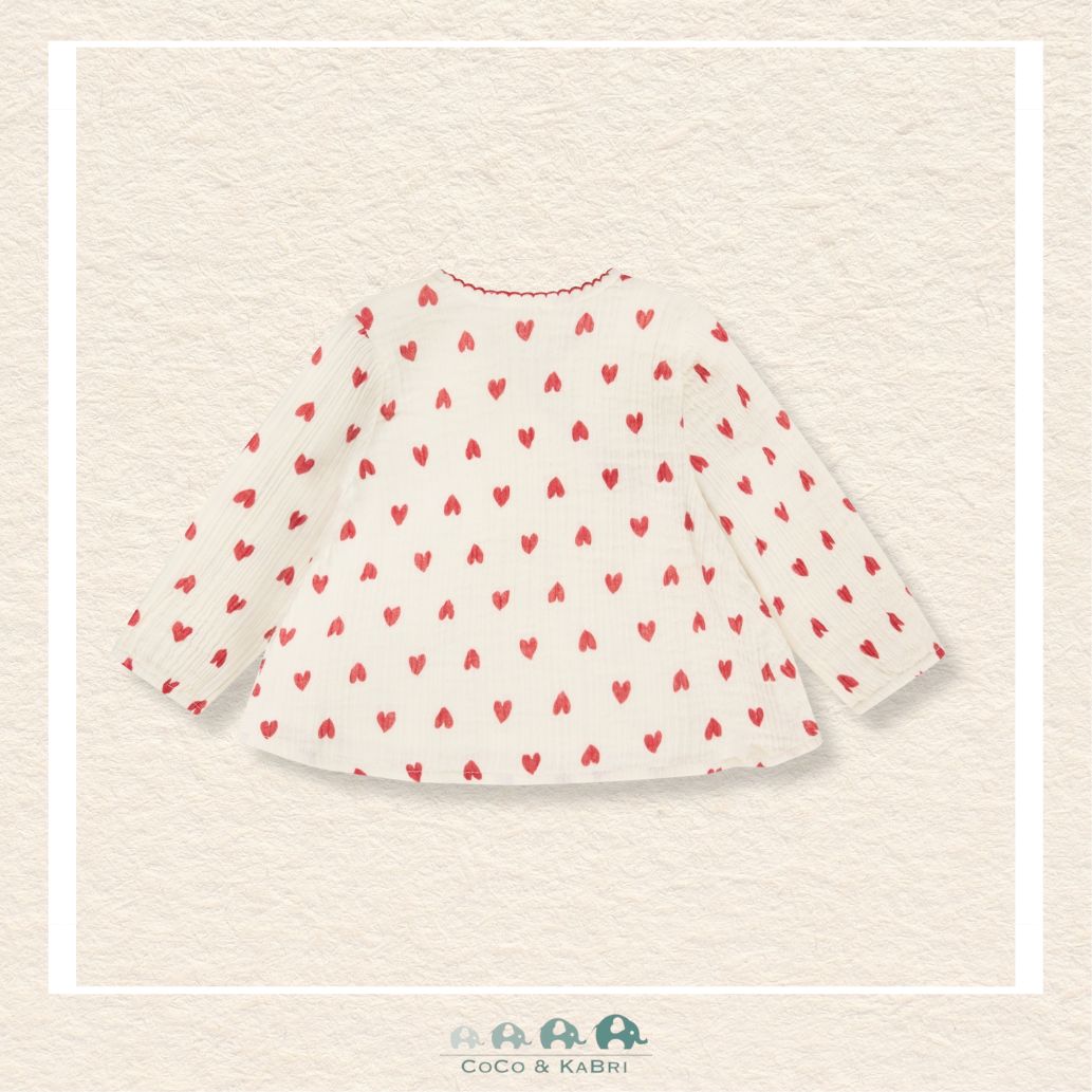 Back view of the baby girl blouse showing the clean hemline and the durable stitching designed for active little ones