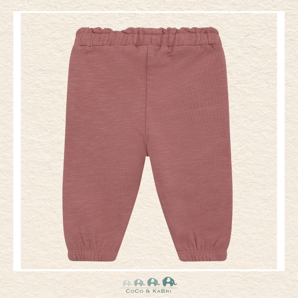 Close-up detail of the Minymo Baby Sweatpants highlighting the muted Burlwood hue and the soft, brushed interior of the premium cotton-stretch knit fabric