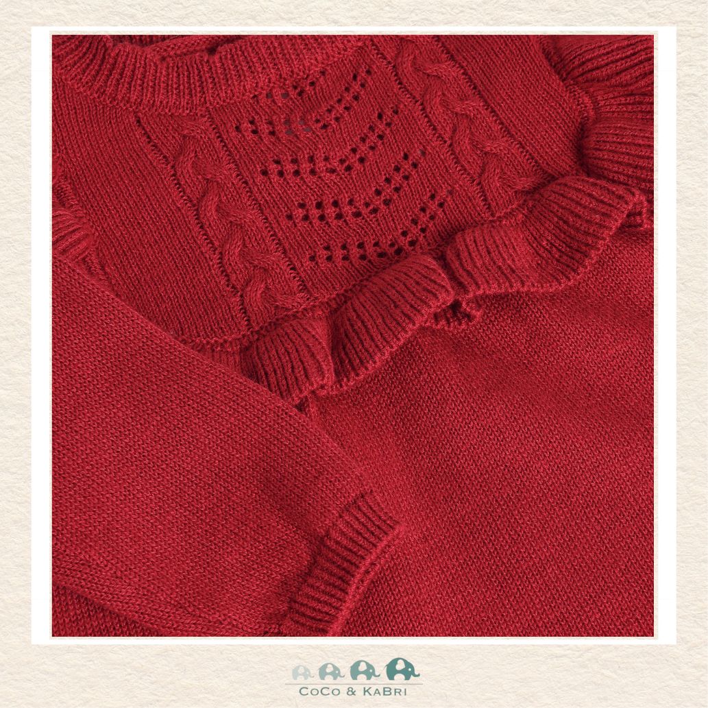 A detailed close-up of the Minymo knit fabric highlighting the premium 80% cotton and 20% wool blend texture and the rich, saturated red hue