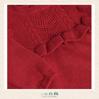 A detailed close-up of the Minymo knit fabric highlighting the premium 80% cotton and 20% wool blend texture and the rich, saturated red hue