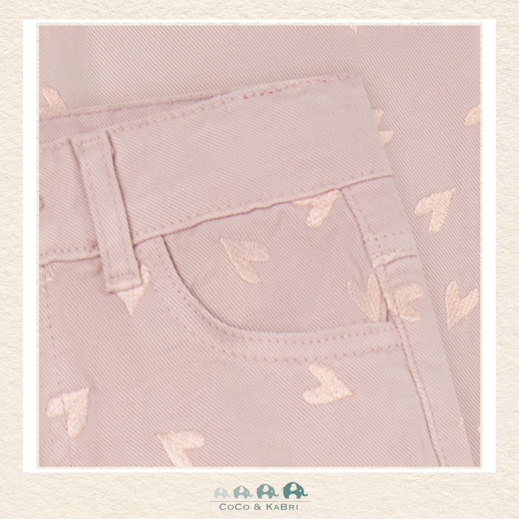 Close-up detail of the Minymo Heart Pants highlighting the high-quality woven twill texture and the delicate, precise embroidery of the repeating heart pattern