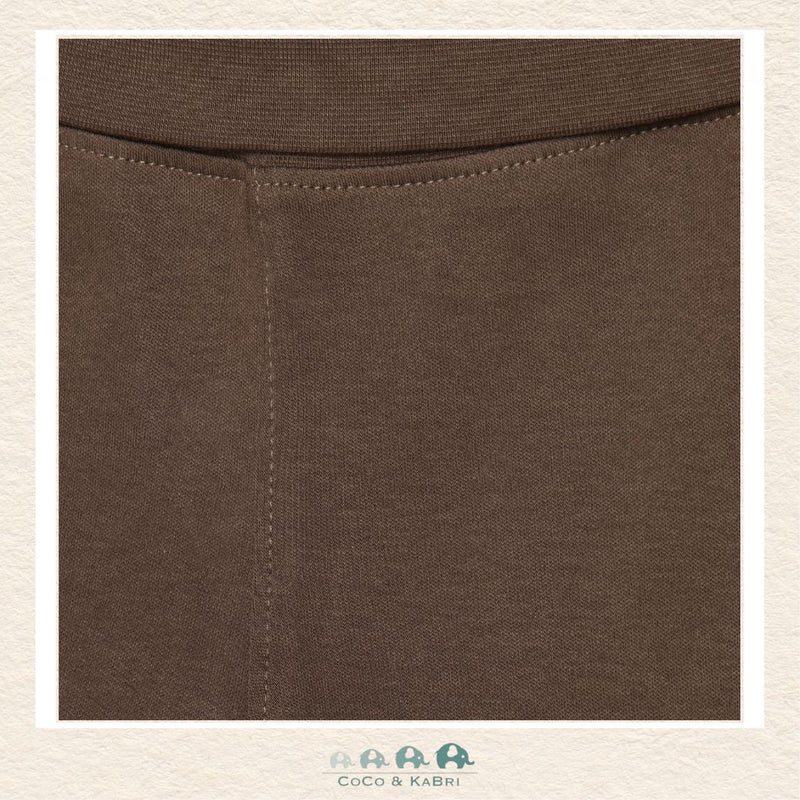 Close-up detail of the Minymo Sweatpants highlighting the rich earthy brown color and the soft, breathable texture of the premium 100% cotton-knit fabric