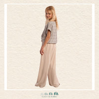 Back view of the model wearing the Molly Bracken flowing pants, demonstrating the clean, tailored waist and the relaxed A-line flare through the legs
