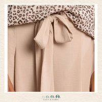 Front view of a girl wearing the Molly Bracken Cream Flowing Pants, showcasing the elegant wide-leg silhouette and the soft, ivory-toned fabric that creates a sophisticated boutique look
