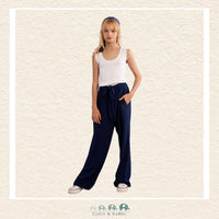 Front view of a girl wearing the Molly Bracken Navy Flowing Pants, showcasing the sophisticated wide-leg silhouette and the comfortable, high-waisted fit