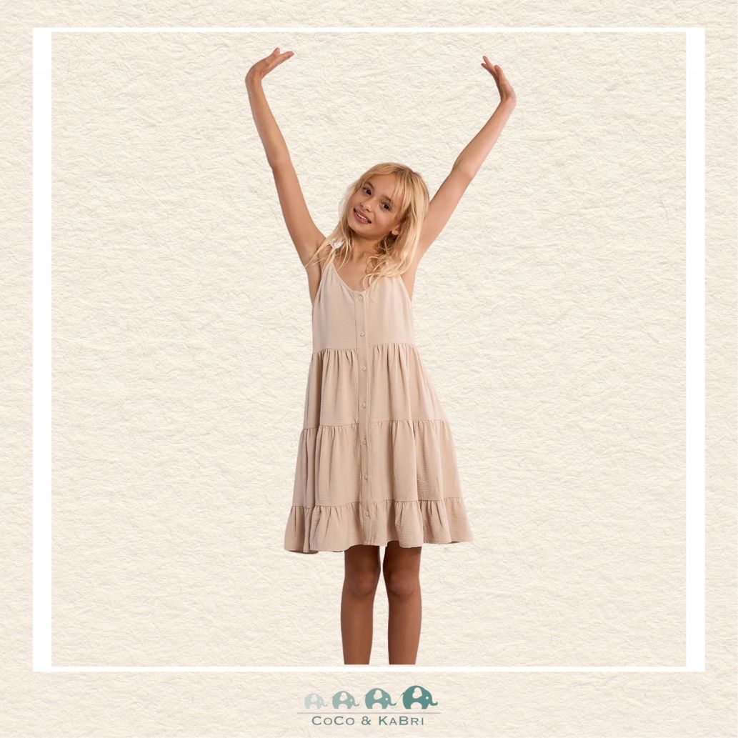 Front view of a girl wearing the Molly Bracken Cream Ruffled Dress, showcasing the flattering V-neckline and the elegant drape of the full-length button-down front