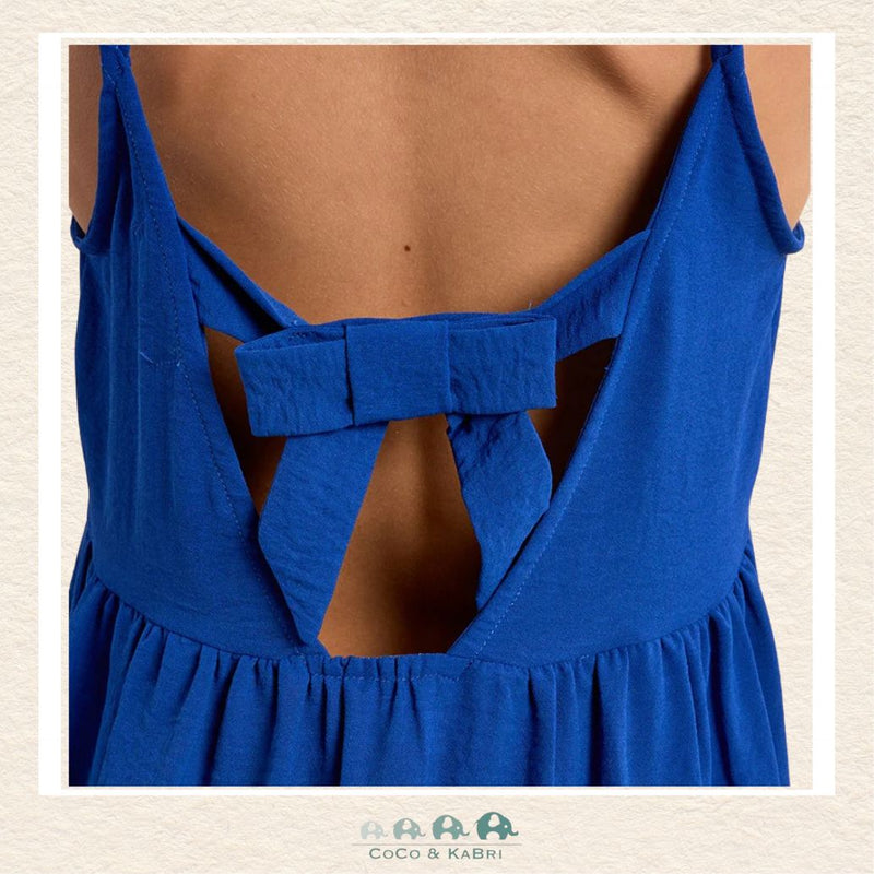 Back view of the model wearing the Molly Bracken dress, demonstrating the breezy A-line silhouette and the beautiful movement of the tiered skirt