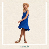 Side profile of the model in the cobalt blue woven dress, highlighting the airy ruffled tiers and the perfect fit of the thin adjustable straps