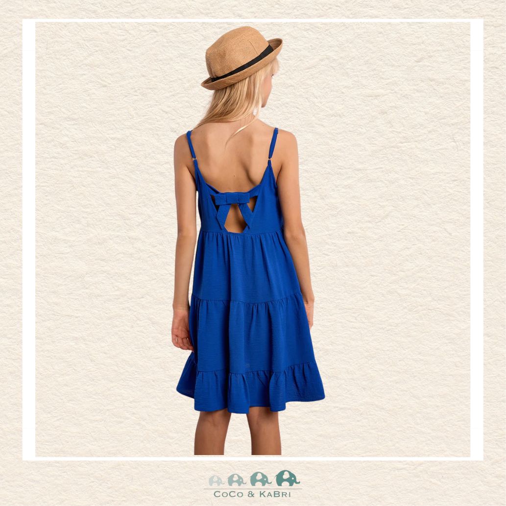 Back view of the model wearing the Molly Bracken dress, demonstrating the breezy A-line silhouette and the beautiful movement of the tiered skirt