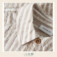 Detailed close-up of the Name It organic cotton weave highlighting the breathable fabric quality and the durable, baby-safe button detailing