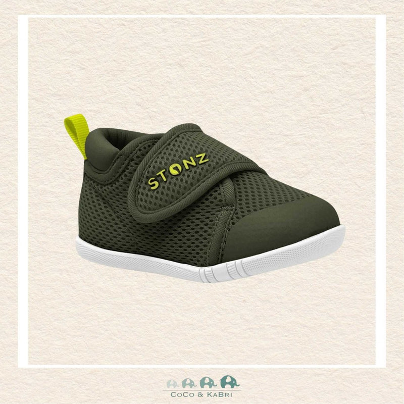 Green baby shoe with 'STONZ' branding on a beige background Brooks Alberta Canada