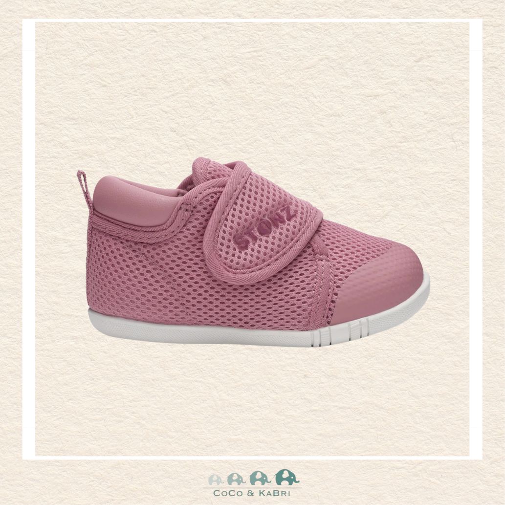 Pink baby shoe with a strap on a beige background, Brooks Alberta Canada